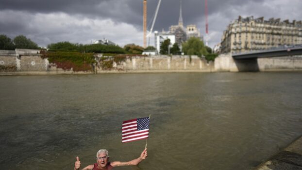An American swims in Paris' Seine River before the Olympics despite contamination concerns